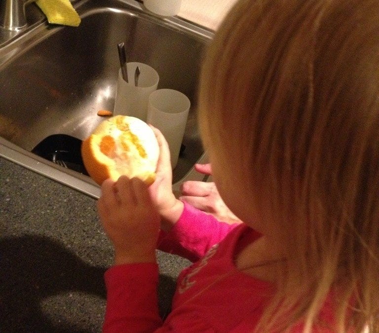 Helping peel an orange