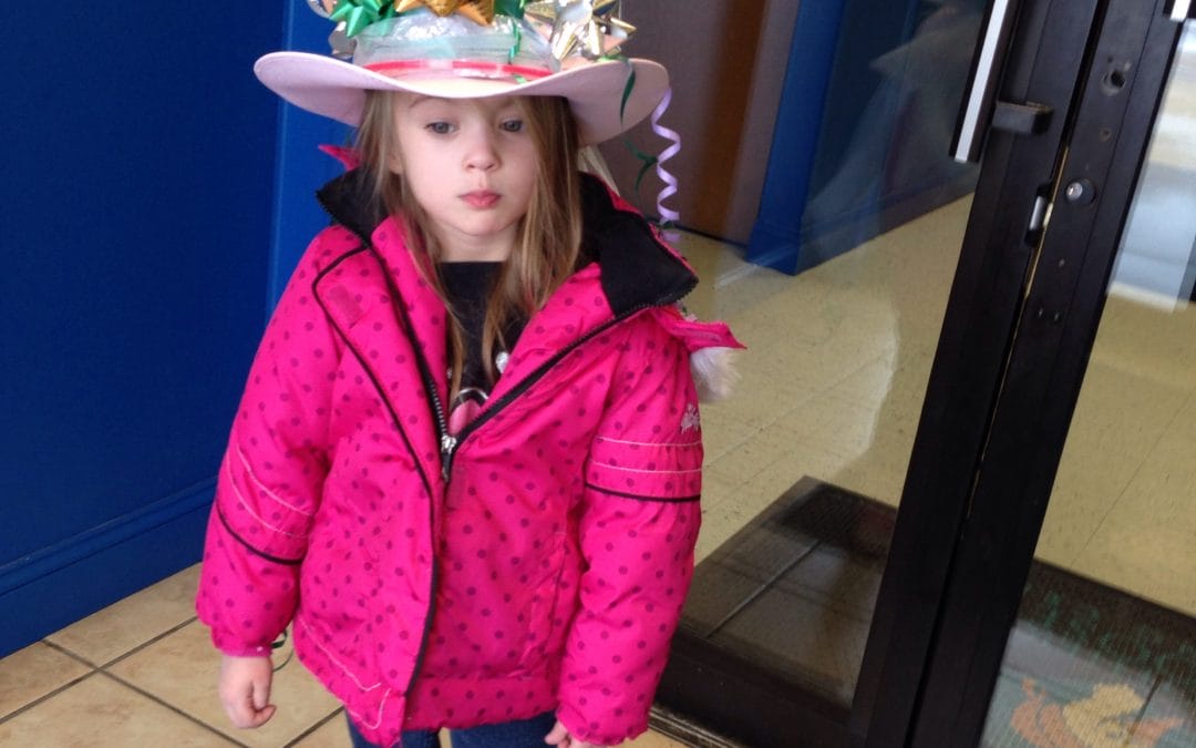 Crazy hat + snow = happy Maddy